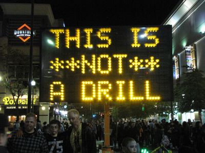 Normally this would be illegal (like in this case), but this time, they actually set a sign board up and rotated through several messages: "ZOMBIES!", "ZOMBIE ALERT", "THIS IS **NOT** A DRILL", "UN-DEAD AHEAD", and "HIDE YOUR BRAINS". Classic.