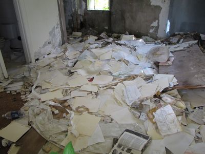 All sorts of paperwork dumped in a former motel room