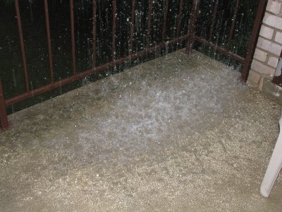 The amount of rain hitting the balcony from the gutter at about the peak of it all.