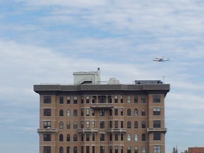 Discovery flies past The Cairo, directly north of our building.