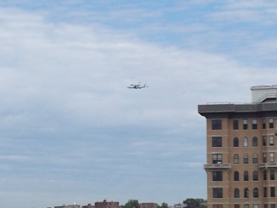 Discovery flies past The Cairo, directly north of our building.