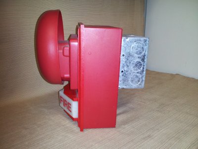 My heaviest alarm setup.  This is a Simplex bell mounted to a Simplex light plate and backbox.  Note, however, that there is a generic backbox attached to the red Simplex one.  This is to balance the weight of the bell, because the whole unit would fall forward because of the bell on the front.  This also proved to be a troublesome signal to photograph, as I ended up having to borrow the proper size allen wrench to remove the gong from the bell in order to break this assembly down for photographing.