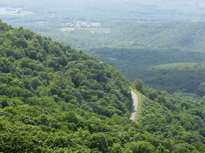 View to the southwest. The road near the center of the photo is the Blue Ridge Parkway, approximately at the elevation where the trail starts.