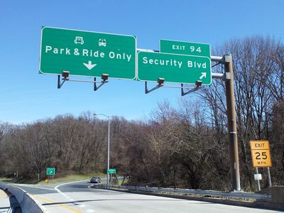 Final overhead sign assembly on I-70 east. Note the "END STATE MAINTENANCE" sign at the exit ramp for Security Boulevard. The final stretch of I-70 is maintained by the Baltimore City Department of Transportation rather than SHA.