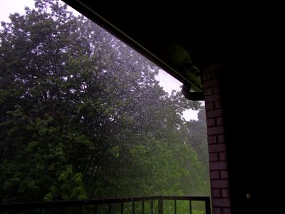 Rain coming off the gutters.  Whenever it rains really hard, the gutter over my balcony gets overwhelmed, and water starts coming really heavily out of one particular spot.