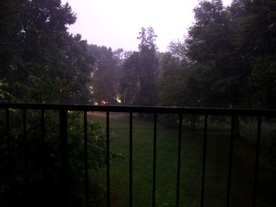 View from my balcony.  Notice how bright it is.  That brightness is from the lightning.  It was dark out, but the lightning, coupled with the long exposure, makes it look like it was daylight out under mostly cloudy skies.