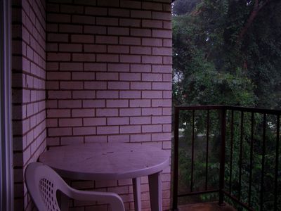 Balcony and balcony furniture.  The lighting quality of this photo reminds me of stuff that I've done with Duckie, since photos from that camera have a slight red tint to them.  But like the other shots, that is all lightning.