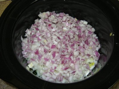 Both containers of onion in the pot.