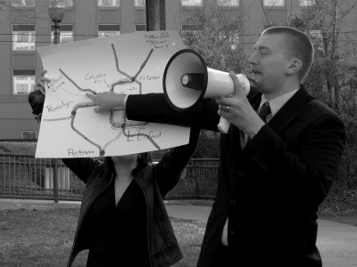 Bruce (with the bullhorn) discusses the course, explaining how Dupont Circle is probably the furthest west that participants should go on the Red Line.