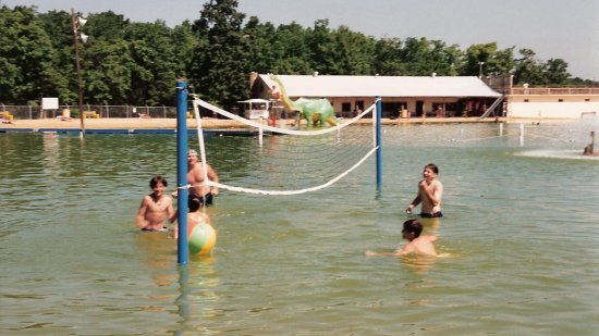 This photo, taken in the 1995 or 1996 season based on the presence of both Clyde the Slyde and the original beach house, shows the volleyball net that was set up in the lake.