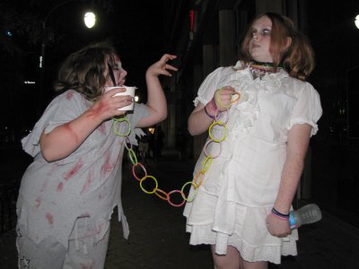 It was rare to find kids south of Ellsworth Drive, but these two kids were there, with their mother.  The zombie on the left was on a glow stick leash, led by the one on the right.  And apparently the zombie on the right is terrified by the one on the left...