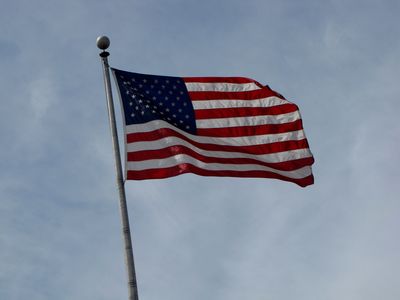 American flag flying near the harbor.