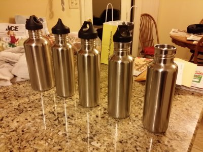 Klean Kanteen water bottles, polished to a shine, on my parents' kitchen counter