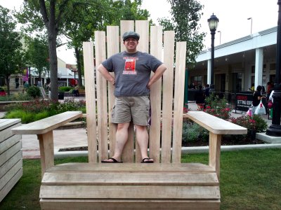 Standing in the giant lawn chair