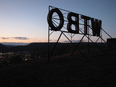 View from behind the sign at sunset, facing the town.