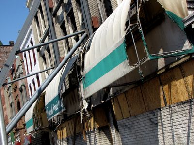 The canopy on the old Hecht's building.  I don't know if the awning's current state is a direct result of the fires, or if it was cut away to erect the steel.  I'm guessing a little of both.