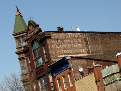 This building had a few iterations of a painted sign on an exterior wall.  From what I can tell, it's "Rosenstein's Big Store Clothing and Furniture".  Not entirely sure what the two other versions of the sign said.