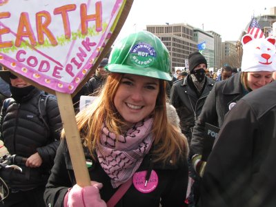 Alli from Code Pink in a hard hat