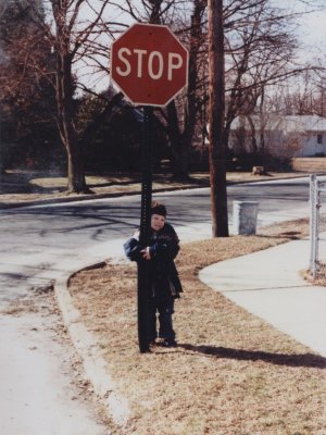 Posing with the "falling down stop sign" in 1983