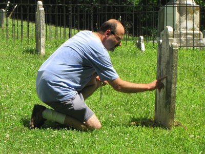 Pete reads a gravestone