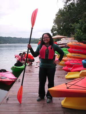 Doreen poses with her paddle after getting out of her kayak.