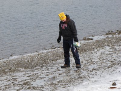 Putting ice melt on the ground