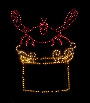 Let me just say that this crab looks way too happy for someone who is about to be boiled to death.  Yes, it is standing over a pot of boiling water, grinning like an idiot.