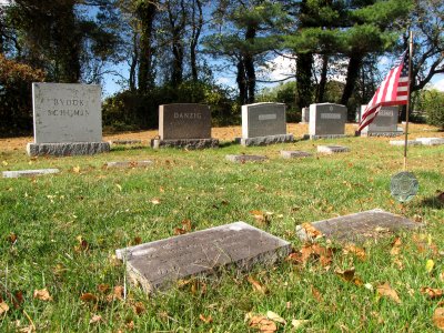 The complete setting.  Grandma is closest to the camera, at the center of the photo near the bottom.  Pop is to her right, with flag.  Aunt Ruth is at extreme left, next to the main memorial.  Uncle Seymour is to her right.