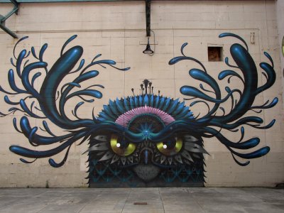 One of the murals that adorns the semi-enclosed part of the Canal Walk (pictured here in 2002). I saw this, and thought it looked like the evil twin of Looney Bird (from The Rock-afire Explosion).