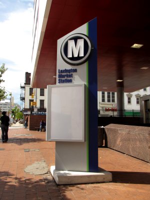 Sign for Lexington Market on the Metro Subway. An "M" at the top of a sign is something that I'm used to.
