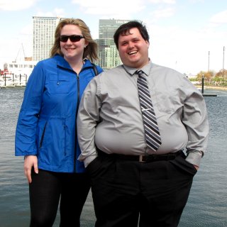 Melissa and Jason pose in front of the harbor.