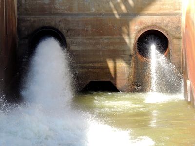 Pipes where water is discharged from the dam.  The pipes, coupled with the unknown opening beneath, remind me of a face.