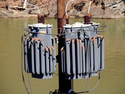 Pole-mounted transformers.