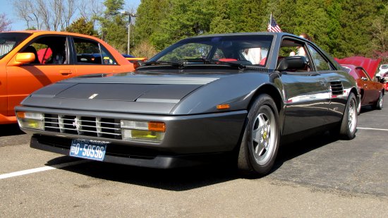 A Ferrari Mondial.  I'd dare say that there is no doubt about what decade this car is from, as the styling is very 1980s.