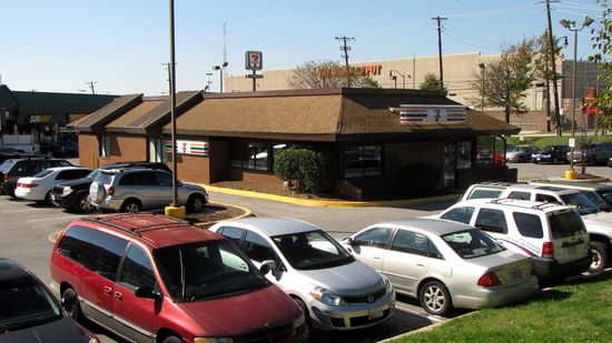 This 7-Eleven is a former 1980s-style Burger King. It would have looked similar to this when it was Burger King. According to Street View imagery, this housed a branch of the DC DMV until some time between July 2009 and July 2011. The only imagery that shows the building as a 7-Eleven is from this year, which makes me think that this was a recent change.