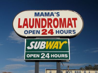 However, the sign for Church's Chicken didn't go with the wings place. Rather, it's now advertising a laundromat at the end of the shopping center.