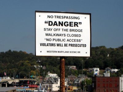 Sign warning would-be adventurers away from the Western Maryland Scenic Railroad bridge. The scare quotes, though, amused me. Why the scare quotes around "danger" and "no public access"? Is that code for something else, like the entrance to a villain's secret lair or something?