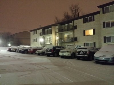 Looking back towards my building as the snow comes down in the evening, just before 11:00 on Wednesday evening.