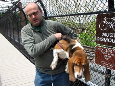 Pete carries Bruno down the stairs