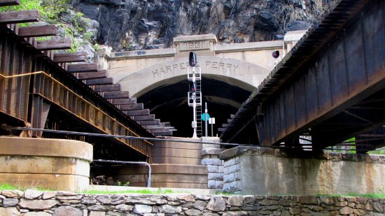 Railroad tracks leading up to the Harpers Ferry tunnel.  The tracks on the left side are the CSX Cumberland Subdivision, and lead toward the MARC station, and eventually to Cumberland.  The track to the right is the CSX Shenandoah Subdivision, eventually leading to Strasburg, Virginia.