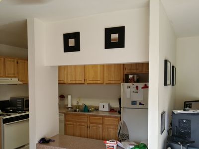 The Malma mirrors from IKEA that I stained black, over the kitchen counter on the living room side.