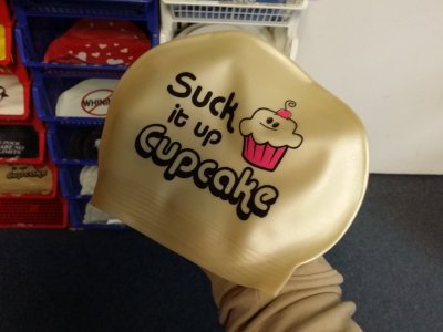 "Suck it up, cupcake" swim cap at Aardvark
