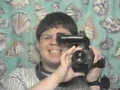 An early selfie, taken in the mirror of the upstairs bathroom at Park Place in 1997. Yes, that is one of those old camcorders that took the full-size VHS cassettes. This thing was dated even then, but it did good work. My parents still have it, though the chance that anyone ever uses it again is exactly zero.