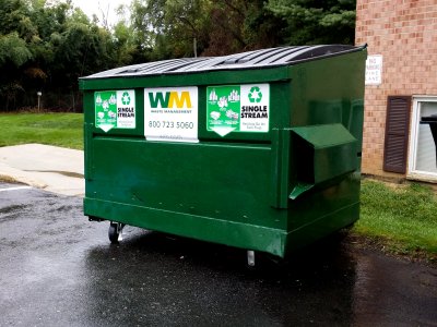 A dumpster marked "SINGLE STREAM"