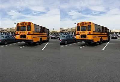 School bus 13514 parked across four spaces