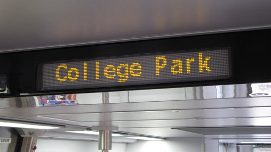 The new interior LEDs can display larger text than before, and use orange text rather than red (though at least the 6000-Series is capable of showing other colors).  Unlike the 6000-Series, there is nothing like this in the center of the cars, though this is made up by other devices.  During the display, the sign alternated between "Next stop is" and "College Park".  I don't know if this particular style of message is just for station stops, or if there are other messages as well.