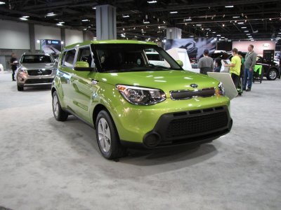 A green Kia Soul