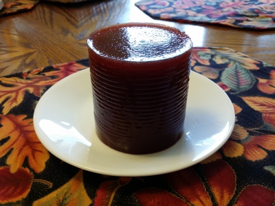 Cranberry sauce on a plate, still very much can-shaped.