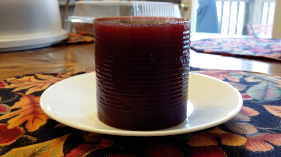 Cranberry sauce on a plate, still very much can-shaped.