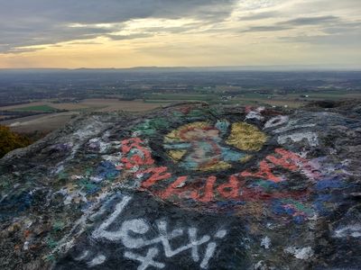 View facing approximately west, plus peace sign graffiti.